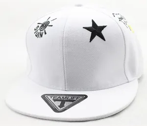 Detail of white kids baseball cap featuring black star embroidery and flat brim style