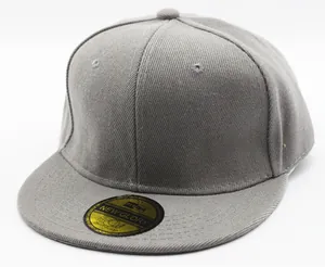 Close-up of dark grey snapback cap showing twill fabric texture and golden peak sticker