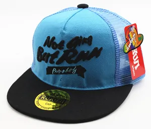 Detail of blue mesh baseball cap featuring black 3D embroidery and flat brim design