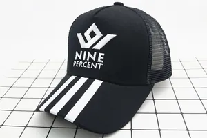 Detail of black mesh trucker hat with NINE PERCENT embroidery and striped brim