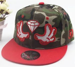Detail of snapback hat with camouflage crown, red brim, and embroidery art