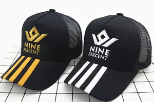 Detail of mesh baseball caps featuring Nine Percent embroidery and striped visor