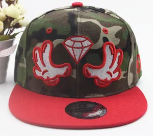 Detail of woodland camo snapback hat with red brim and 3D diamond embroidery