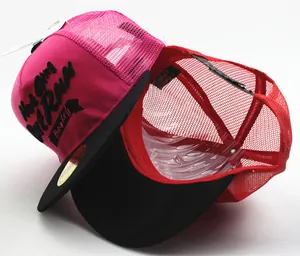Detail of color-block kids trucker hats with 3D embroidery and breathable mesh