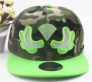 Close-up of camouflage snapback hat featuring white glove embroidery and neon green brim