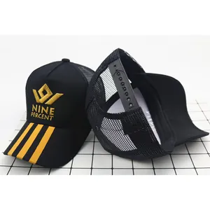 Black mesh trucker hat for kids featuring yellow embroidery and striped visor