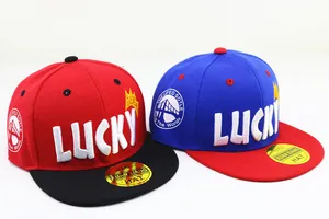 Detail of kids baseball caps featuring LUCKY 3D embroidery and contrast flat brims