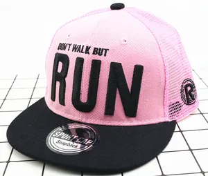 Detail of pink mesh snapback cap with 3D embroidery RUN lettering and flat black brim