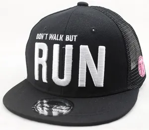 Detail of 3D embroidery on black mesh trucker cap with RUN slogan and laser sticker