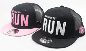 Detail of RUN slogan embroidery on mesh snapback trucker caps for kids and adults