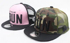 Detail of mesh back baseball caps with RUN 3D embroidery and camo mesh texture