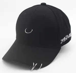 Close-up of black cotton baseball cap featuring silver metal rings and Japanese embroidery