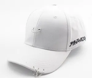 Detail of white cotton baseball cap with three metal rings and Japanese embroidery