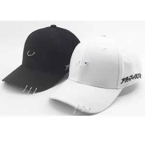 Streetwear cotton baseball caps in black and white featuring silver metal rings