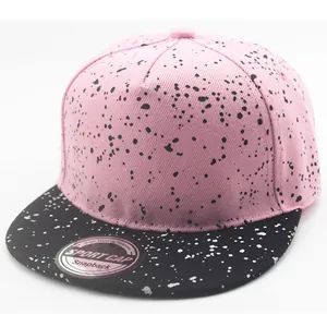 Pink and black snapback hat for kids with stylish white splatter ink pattern design