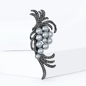 Elegant gunmetal brooch featuring clustered grey pearls and shimmering grey rhinestones