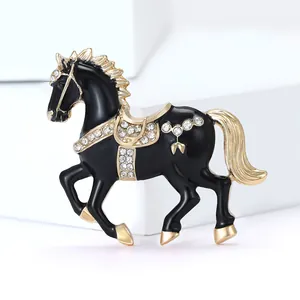 Elegant gold-plated horse brooch with black enamel and sparkling crystal rhinestones