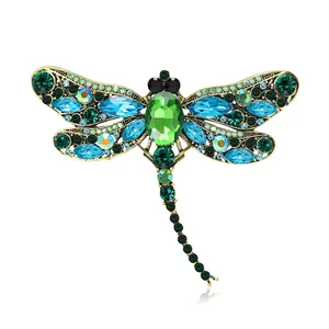 Exquisite dragonfly brooch with multi-colored crystals and rhinestones in vintage gold finish