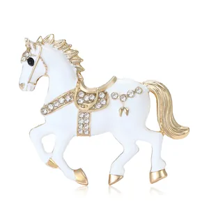 Exquisite white enamel horse brooch with gold plating and sparkling crystal accents