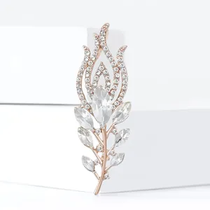 Elegant rose gold peacock feather brooch with sparkling white rhinestones and crystals