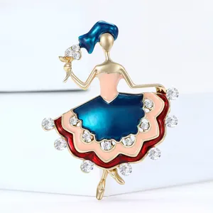 Elegant ballerina brooch with enamel dress and sparkling crystals on golden plating