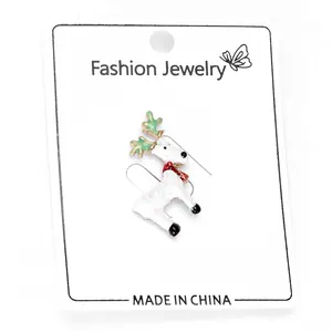 Detailed view of cute reindeer earrings with white oil-drop finish on jewelry card