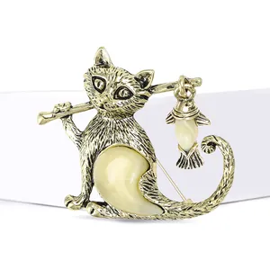 Cute golden cat brooch with yellow resin crystals and hanging fish pendant accessory