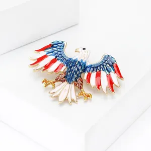 Macro view of eagle brooch with American flag enamel wings on a white stand