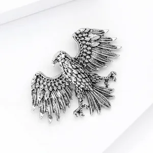 Detailed close-up of eagle brooch showing antique silver finish and feather textures