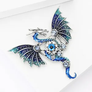 Detail of mechanical dragon brooch with blue enamel and crystal-set wings for suits