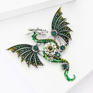 Macro detail of steampunk dragon brooch with green enamel, gears, and rhinestone accents