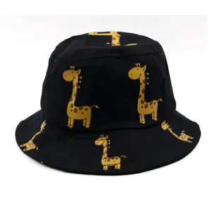 Close-up of black cotton kids bucket hat with yellow giraffe pattern and canvas texture
