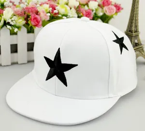 Detailed close-up of black star embroidery on a white cotton snapback baseball cap