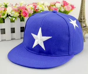 Close-up of white star embroidery on navy blue flat brim snapback baseball cap