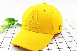 Detailed view of the yellow baseball cap featuring bold letter A 3D embroidery and canvas texture