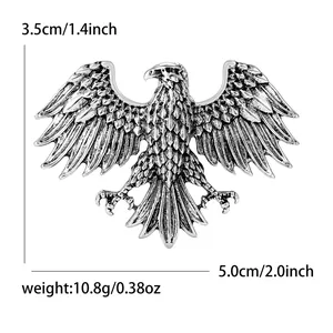 Antique silver eagle brooch with rhinestone inlay and detailed wings showing dimensions
