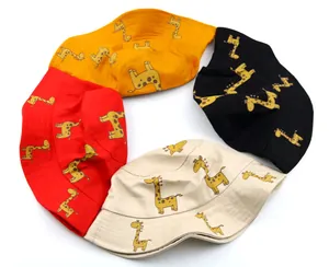 Variety of kids giraffe print bucket hats in orange, black, red and beige colors