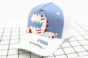 Detail of a kids baseball cap with blue dinosaur embroidery and breathable white mesh