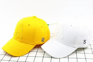 Detail of yellow and white baseball caps with premium 3D letter A and S embroidery