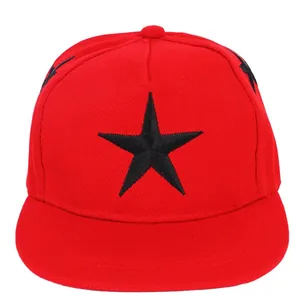 Red kids snapback hat featuring a large black star embroidery and a flat brim style