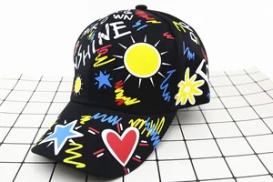 Detail of kids baseball cap with colorful sunshine graffiti and vibrant street art patterns