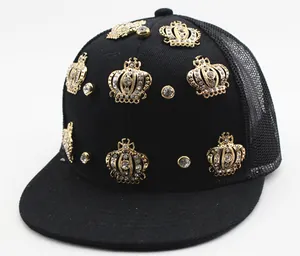 Close-up of black mesh hip-hop hat with golden crowns and sparkling rhinestones