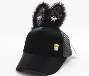 Detail of kids baseball cap with sequined rabbit ears and cartoon potato patch