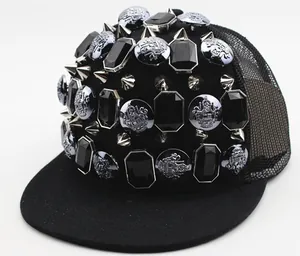 Detailed close-up of hip hop snapback cap featuring silver metal spikes and black gems