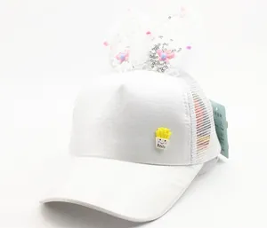 Detail of white mesh baseball cap with sequined rabbit ears and potato patch for kids