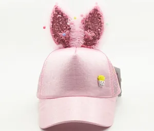 Detail of pink kids baseball cap with sequined bunny ears and potato cartoon patch