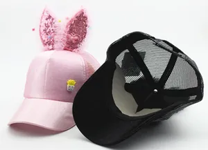 Detail of kids mesh baseball cap with sequin bunny ears and breathable fabric structure
