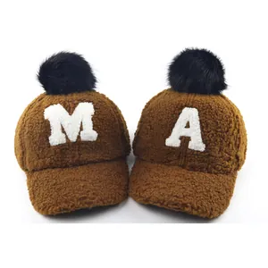 Brown fleece winter baseball caps with fur pompom and letter patches A and M