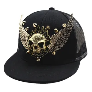 Black punk style flat brim baseball cap with golden skull, wings and spiked studs