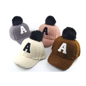 Plush winter baseball caps for kids with fur pompom and letter A embroidery